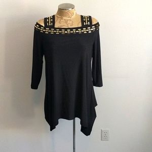 Long black top with gold tone accents
